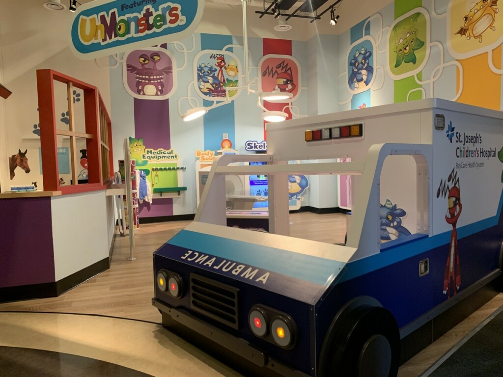 A pretend ambulance and hospital dramatic-play exhibit