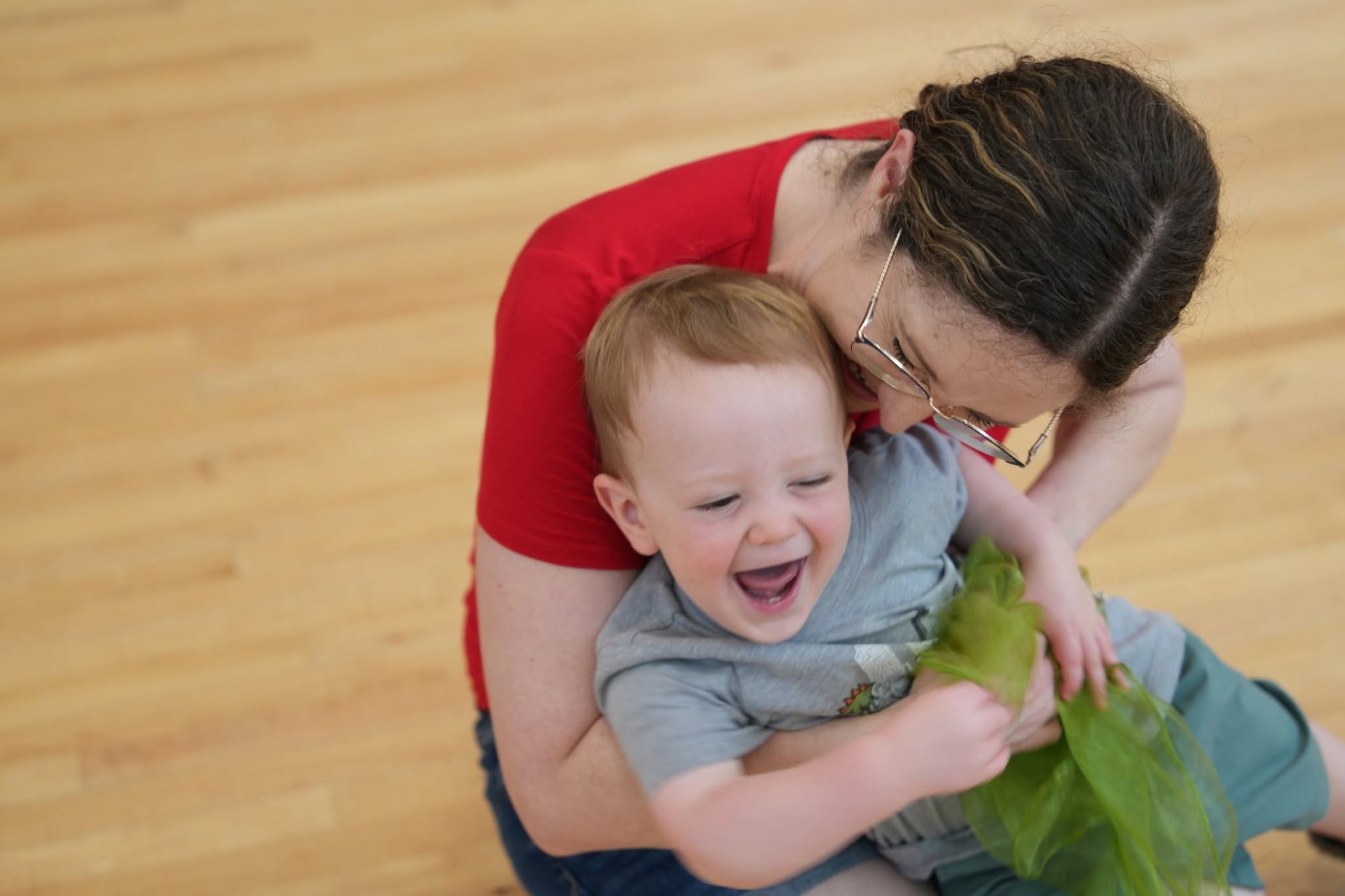 Parent and child laughing together