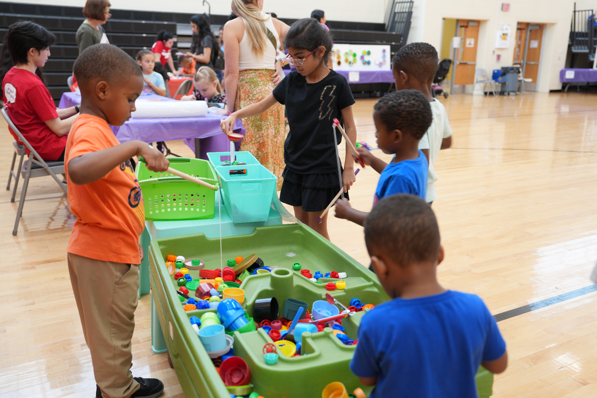 Children exploring a hands-on tinker table